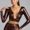 Rana crop-top i metallisk jersey med dyp utringning i kobberbronse
