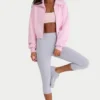 Ribbestrikket, kort sweatshirt med glidelås i blekrosa