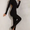 Rumer jumpsuit med høy hals og åpen rygg i svart