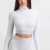 Ryggløs turtleneck-crop-top med lange ermer i grå melert