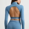 Ryggløs turtleneck-crop-top med lange ermer i stålblå
