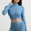 Ryggløs turtleneck-crop-top med lange ermer i stålblå