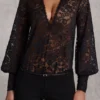 Serenya Sheer Lace Plunge-Neck Loose-Fit Playsuit i svart