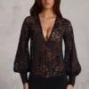 Serenya Sheer Lace Plunge-Neck Loose-Fit Playsuit i svart