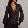 Serenya Sheer Lace Plunge-Neck Loose-Fit Playsuit i svart