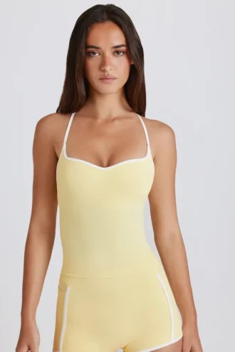 Soft Active-tanktop med kryssrygg i Lemon