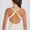 Stretchbomullsjersey-body med lagdelt kryssrygg i krem