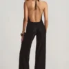 Tulay Devoré halterneck-utskjæringsjumpsuit med åpen rygg i svart