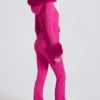 Vanntett skidress med hette i imitert pels i magenta rosa